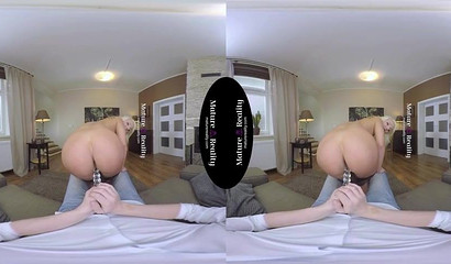 Blonde milf with huge tits rides you in VR