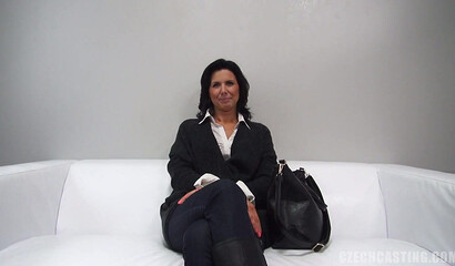 Gun shop milf gets fucked with an intensely serious expression.